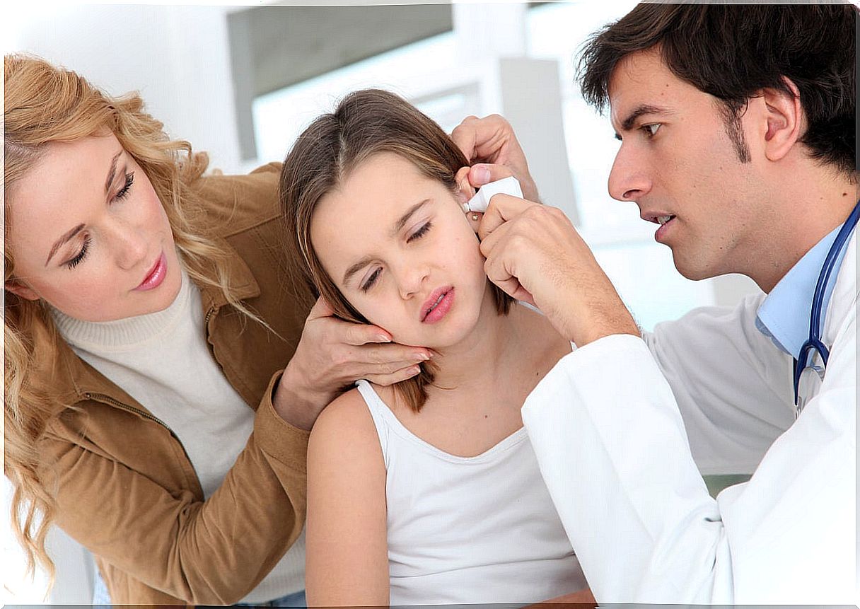 Little girl at the doctor with otitis, one of the diseases caused by bacteria.