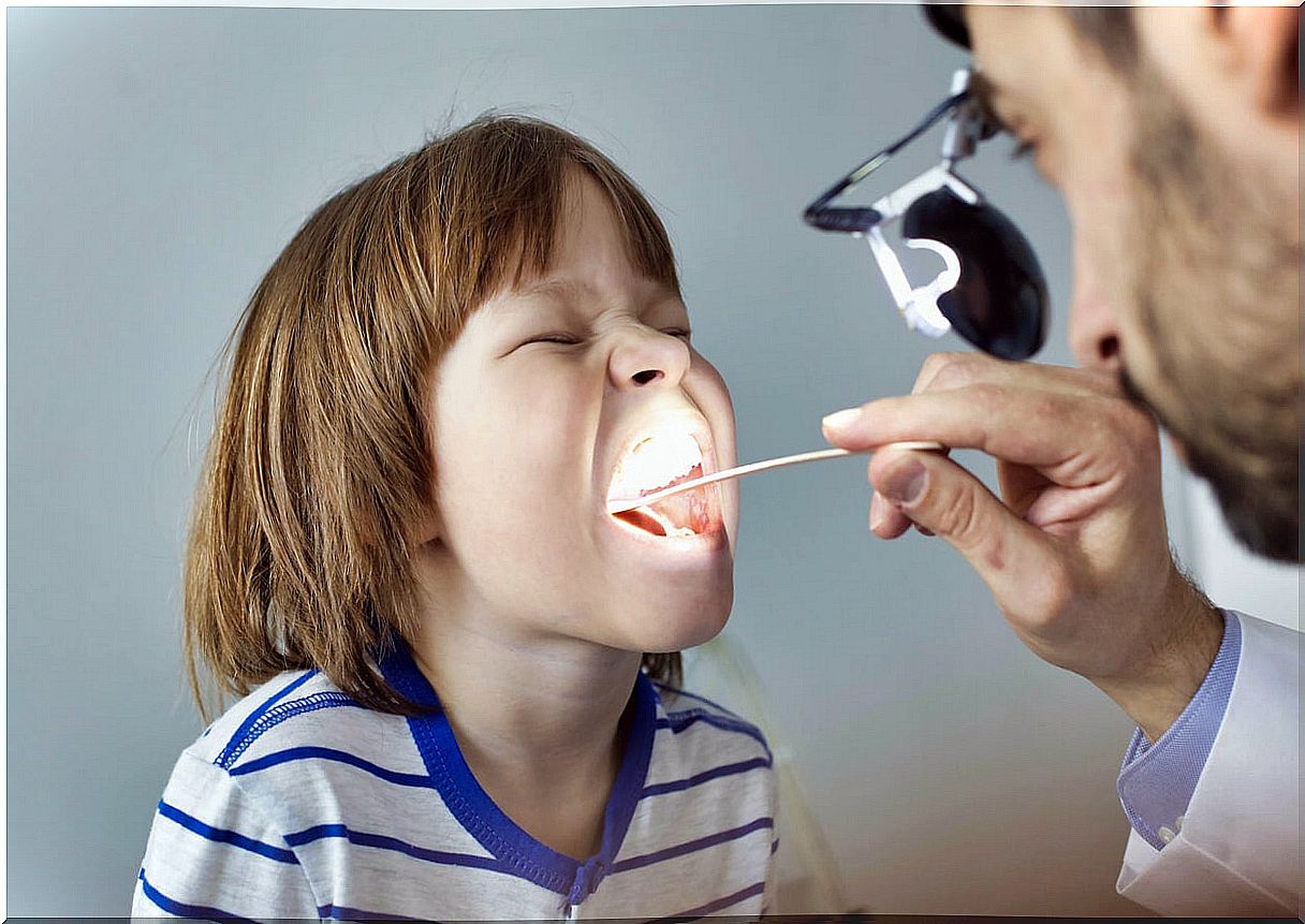 Child at the doctor with a sore throat.