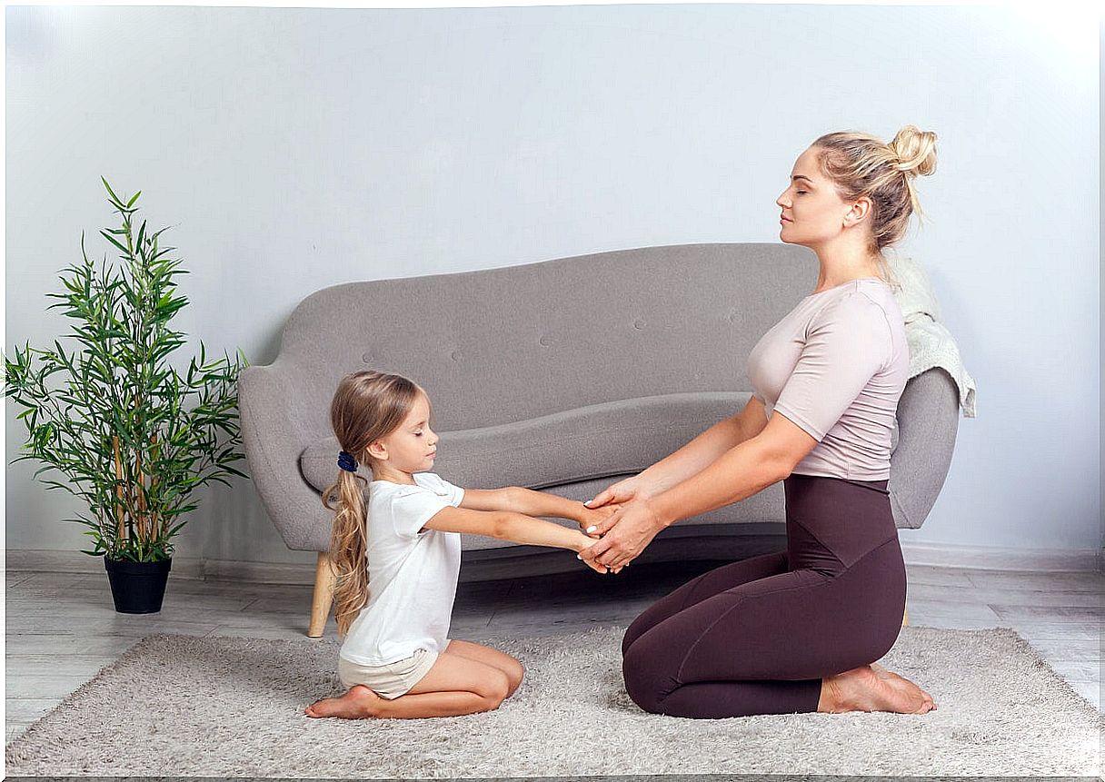 Mother and daughter practicing mindfulness.