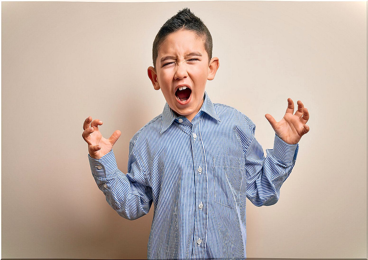 Boy screaming in anger because he does not know how to control it.