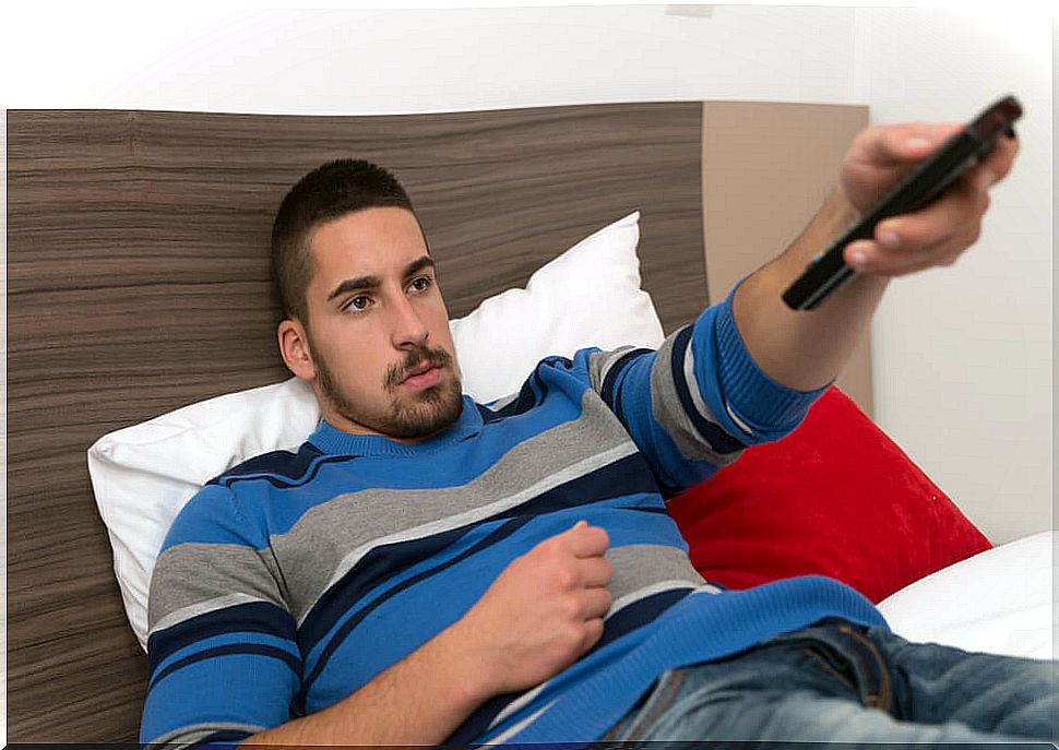 Teen boy watching TV.