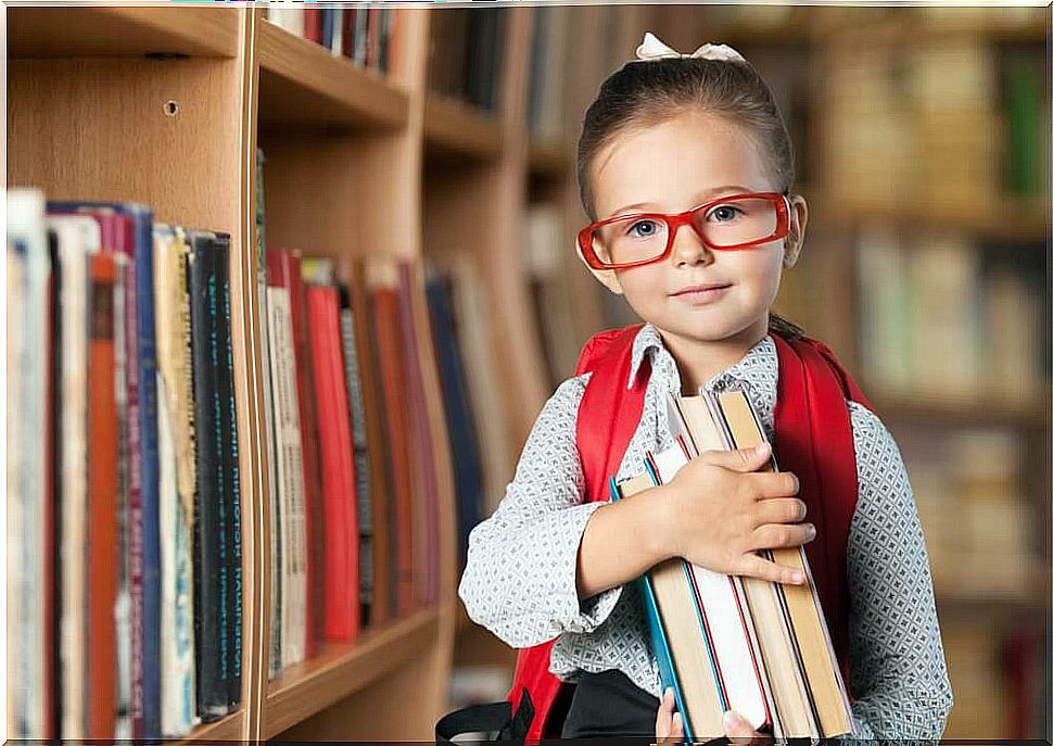 Little girl in the library improving her higher-order abilities.