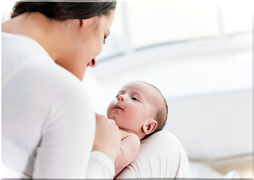 Woman transmitting the emotions of a mother to her baby.