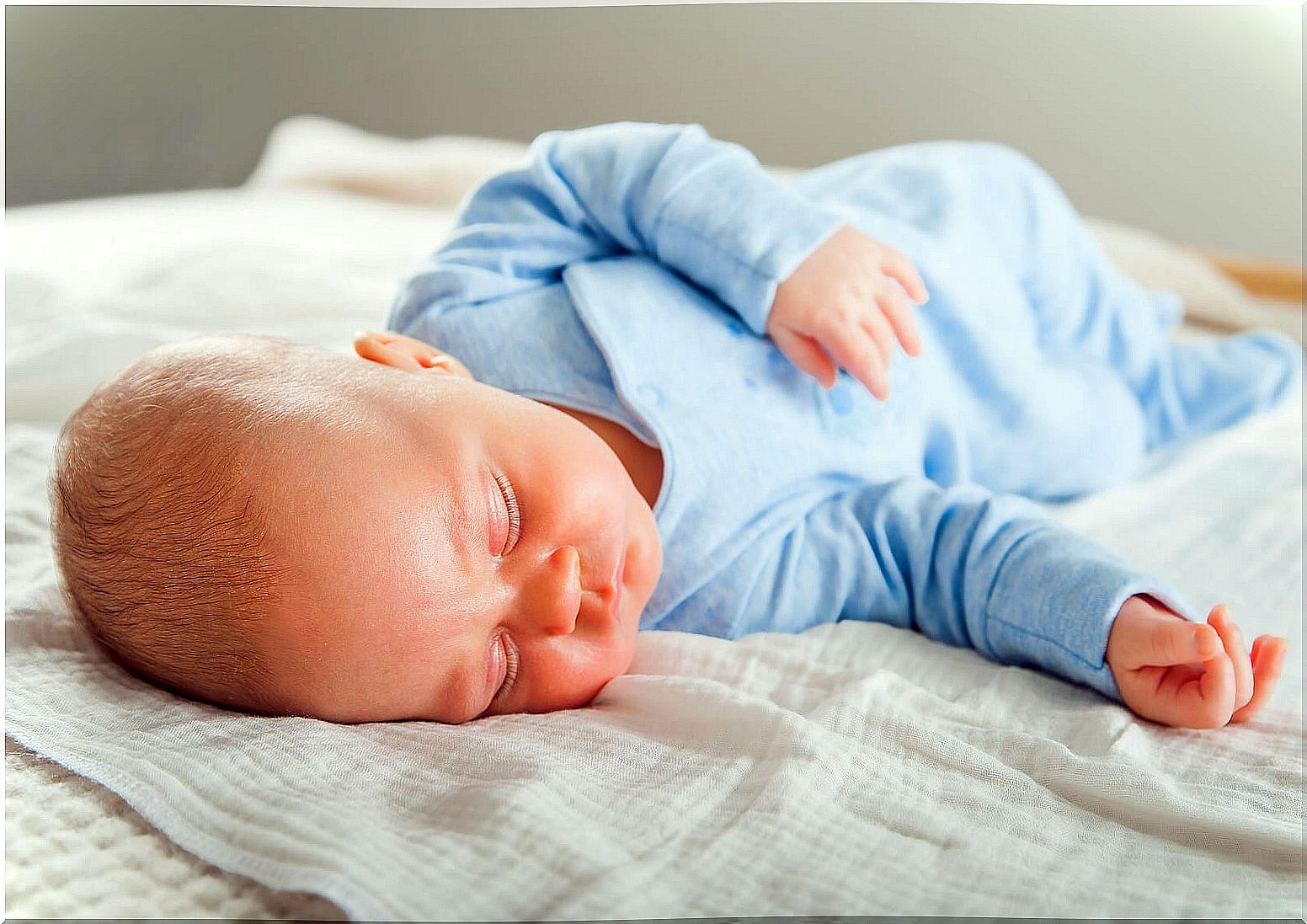 Newborn baby sleeping because he is sleepy.