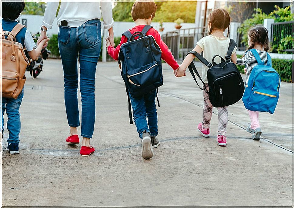 Children going to class at their new school.