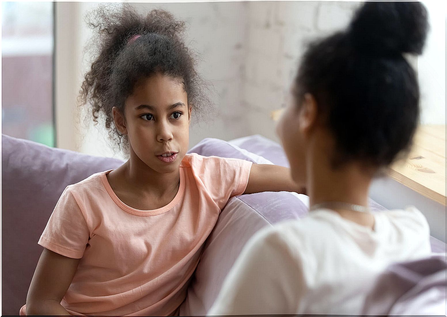 Teen daughter talking to her mother.