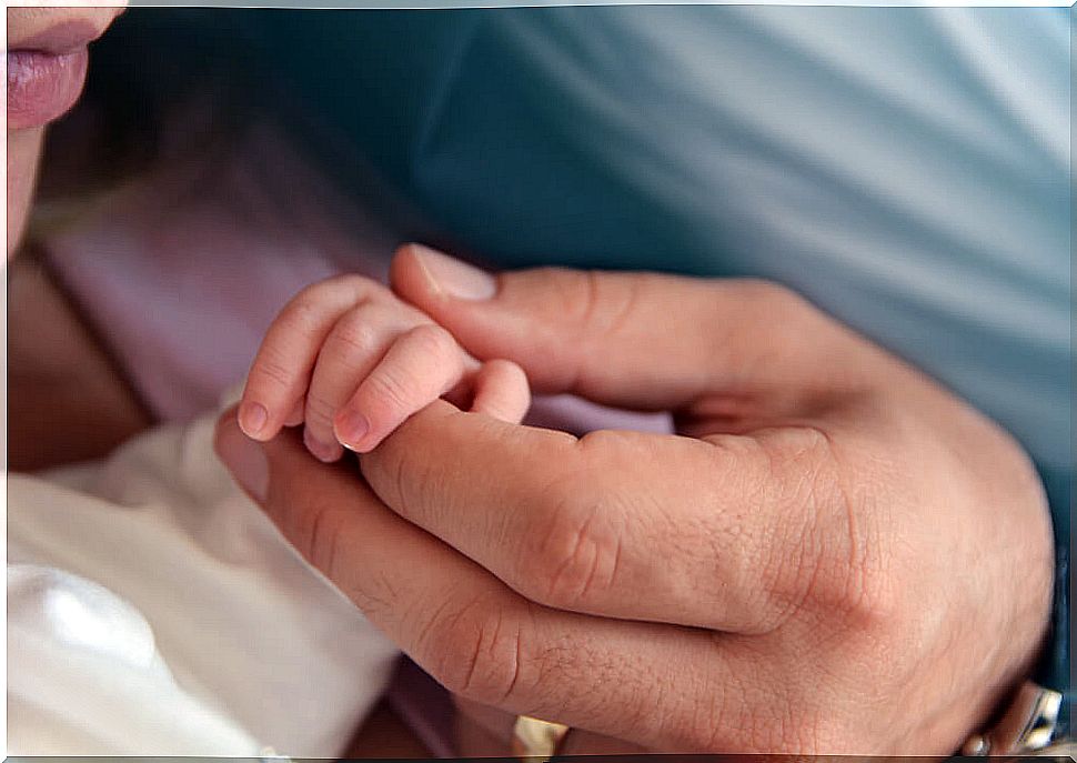 Parents with their baby after the baby is born.