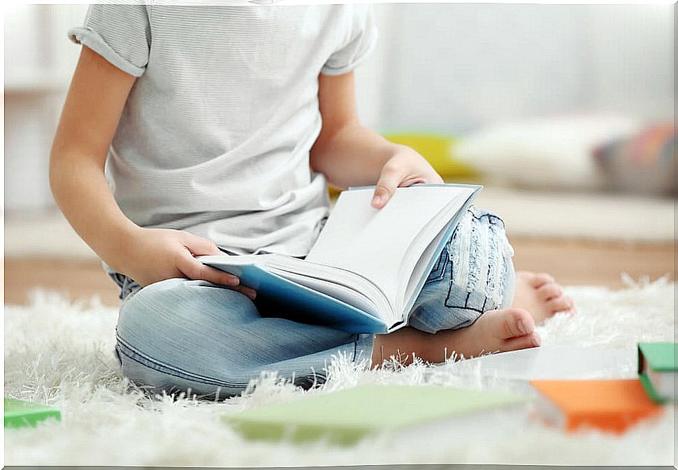 Child reading one of the children's books highlighted by critics.