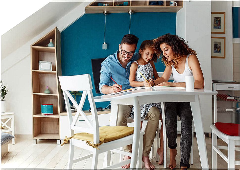 Parents with their daughter enjoying their real learning space at home.