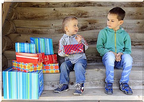 Child being envious of his friend's gifts.