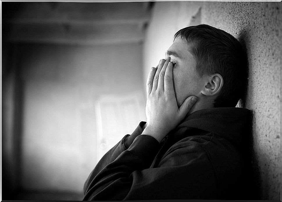 Adolescent boy breaks down in tears in the medical consultation.