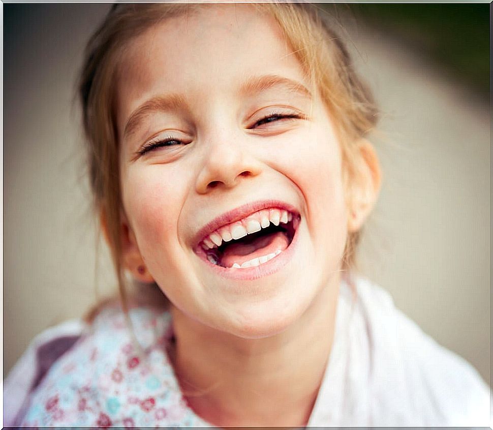 Little girl smiling with happiness.