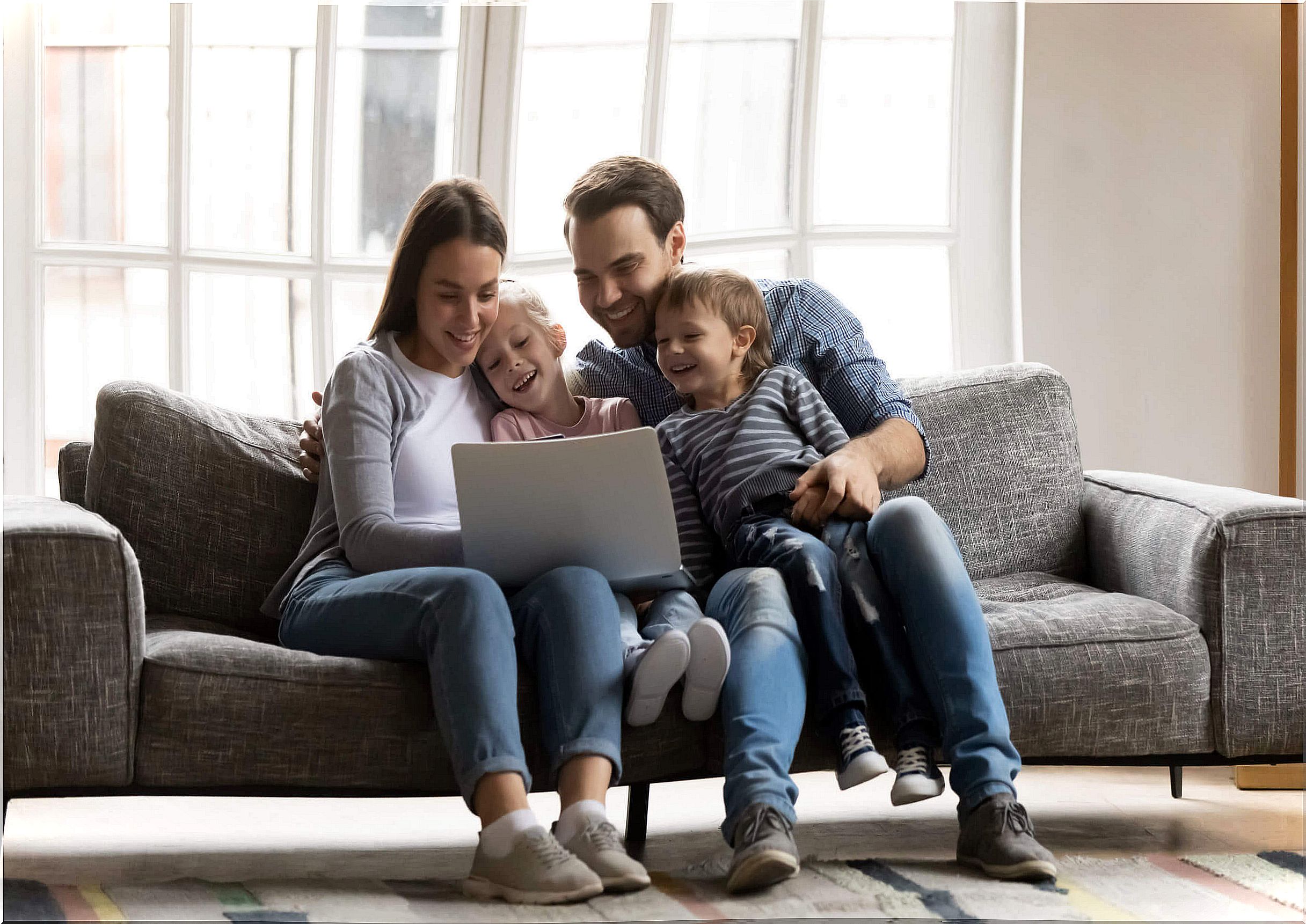 Family watching on the computer some of the best educational YouTube channels for children.