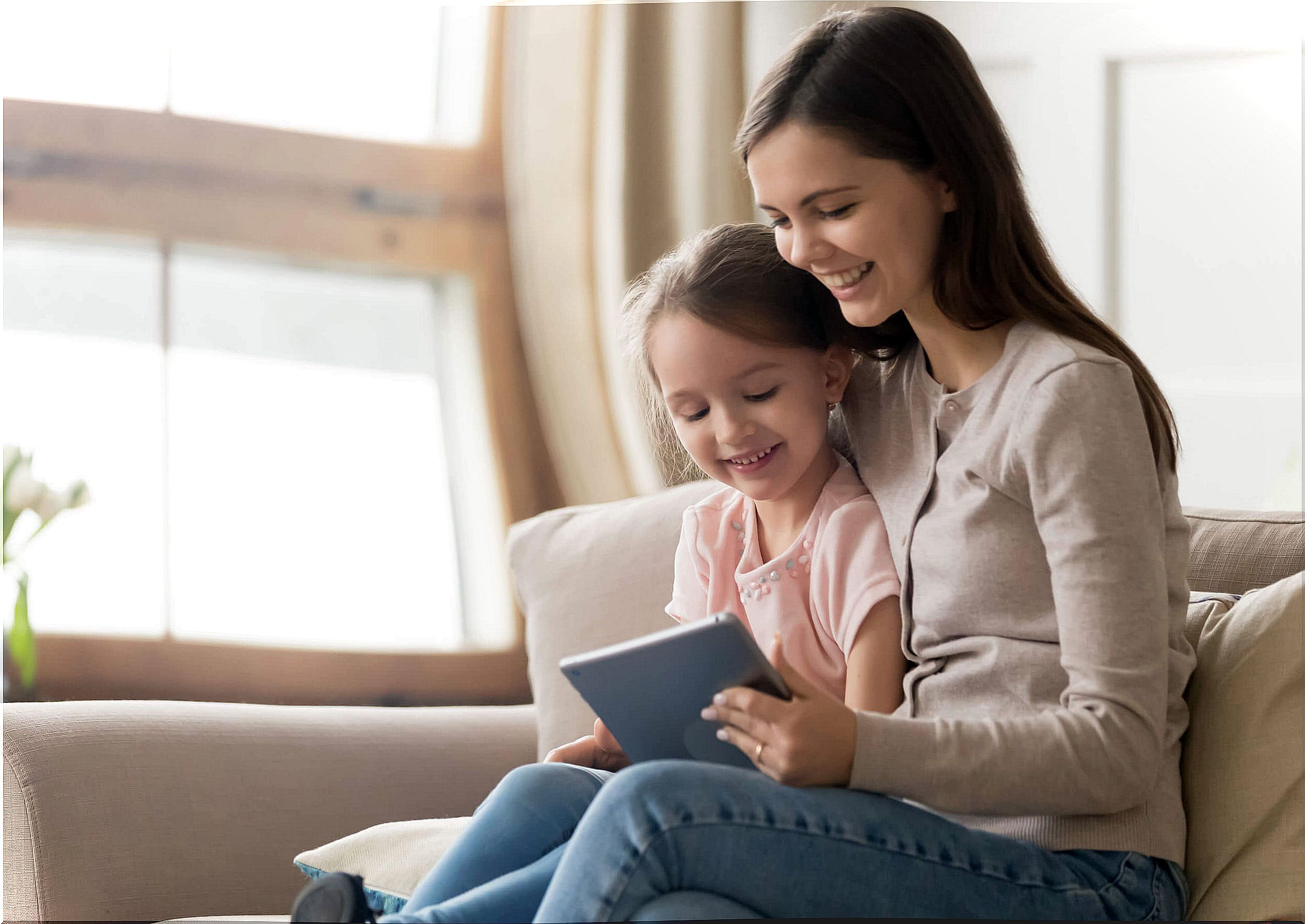 Mother and daughter watching educational channels on YouTube.